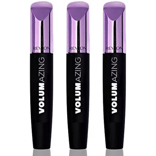 A 3 Pack of Revlon Volumazing Mascara 901 Blackest Black is displayed upright, each tube featuring signature metallic purple caps and black bodies, promising clump-free, fanned-out lashes.